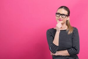 Woman Thinking About Window Coverings