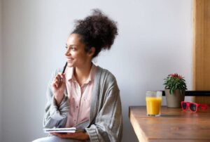 Woman Thinking About Cleaning Mirrors